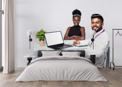 African patient having consultation with doctor in office Wall mural